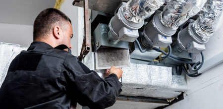 Man fixing fan